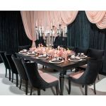Isabella dining chair with Light Pink upholstered seat and curved high back, black wood legs, sleek modern seating for weddings and events.