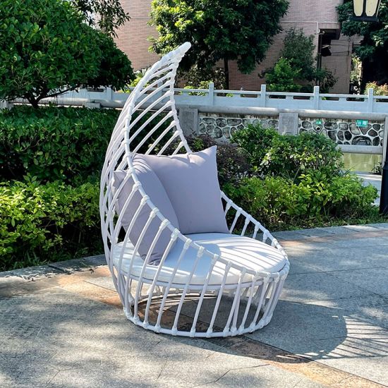 White leaf chair with sculptural open leaf frame and seat cushion, modern accent chair rental for weddings and event lounges.