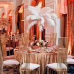 Tall gold metal event chair with vertical slat high back and White cushioned seat, modern luxury seating ideal for weddings and upscale receptions.