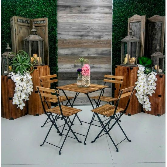 Rustic bistro table with square wood top and black folding metal legs, cocktail table rental for outdoor events and rustic weddings.