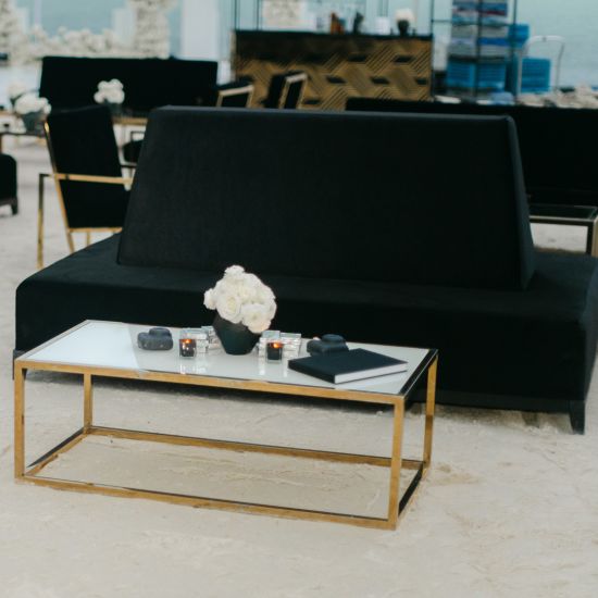 Gold stainless steel Splendor coffee table with minimalist rectangular top and sleek luxury finish for contemporary event lounge décor