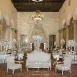 Vintage Pigneto accent armchair with light upholstery and ornate carved wood frame, classic seating for weddings, lounges, and events.