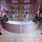 Modern white modular round-bar rental set (2 straight segments + 1 curved segment) forming circular event bar centerpiece.