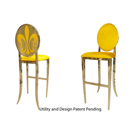 Gold Fleur-de-lis bar stool with Yellow cushioned seat, ornate metal fleur-de-lis backrest and foot-rail base, luxury event bar seating
