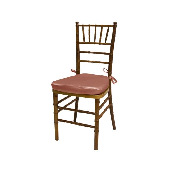 Chiavari chair with natural wood finish, Coral colored padded seat, elegant slatted backrest, and stylish seating for event guests.