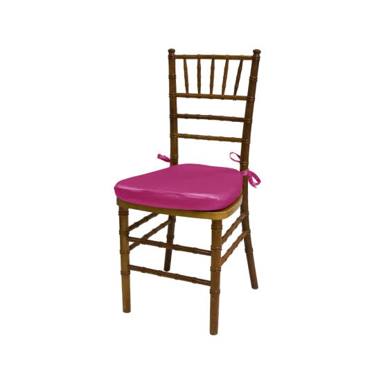 Chiavari chair with natural wood finish, Fuchsia colored padded seat, elegant slatted backrest, and stylish seating for event guests.