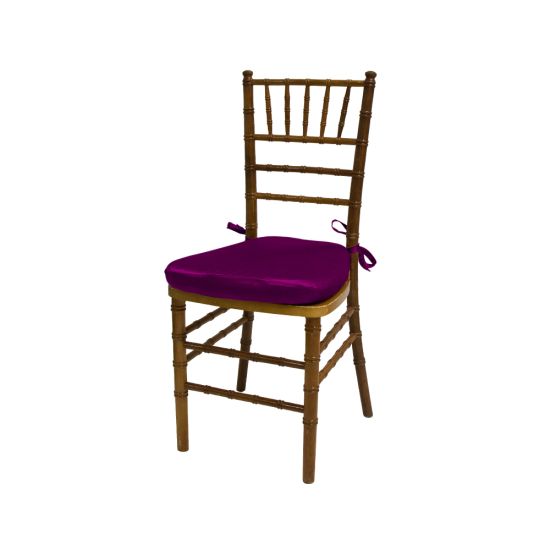 Chiavari chair with natural wood finish, Magenta colored padded seat, elegant slatted backrest, and stylish seating for event guests.