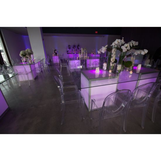 “Clear resin armless ghost chair with high oval backrest and transparent sleek frame, modern event guest seating”