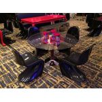 Yellow Phantom chair made of molded resin with fluid one-piece silhouette and high curved backrest, sleek modern event seating