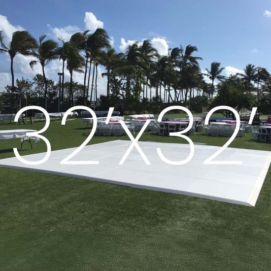 White outdoor dance floor on lawn with 32x32 size overlay text, modular 4x4 panel dance floor for large events up to 300 guests.