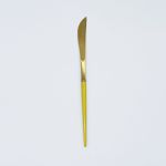 Gold dinner knife with yellow handle, sleek modern flatware for formal dinners, weddings, and luxury table décor.