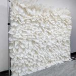White feather-style plume wall backdrop with layered soft texture, elegant wedding photo backdrop panel for events and stages.
