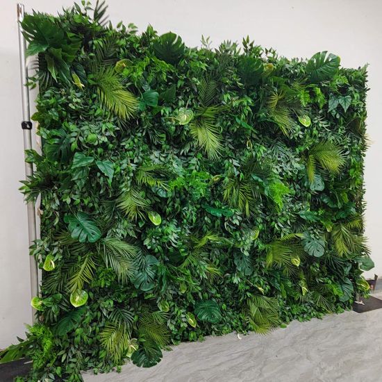 Dense tropical foliage wall backdrop with layered green leaves, botanical photo backdrop panel for events, lounges, and weddings.