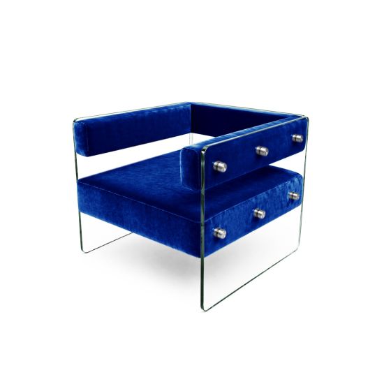 Crystal armchair with royal blue velvet cushions and clear acrylic side panels with metal bolts, modern luxury lounge seating for events and weddings.
