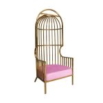 Gold dome cage armchair with vertical gold bars and light pink velvet seat cushion, modern luxury lounge chair for weddings and events.