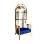 Gold dome cage armchair with vertical gold bars and royal blue velvet seat cushion, modern luxury lounge chair for weddings and events.