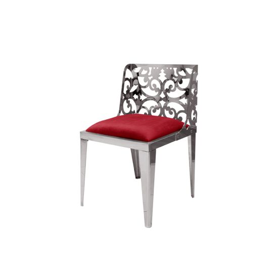 Silver reflection chair with ornate laser-cut scroll backrest and red cushioned seat, sleek modern design for upscale event dining and seating.