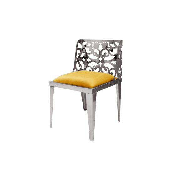 Silver reflection chair with ornate laser-cut scroll backrest and yellow cushioned seat, sleek modern design for upscale event dining and seating.