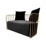 Black velvet accent loveseat with gold metal bar frame and two black pillows, modern art deco lounge seating for luxury events.