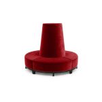 Red velvet round banquette with curved seating and cone center backrest, luxury lounge seating rental for weddings and events.