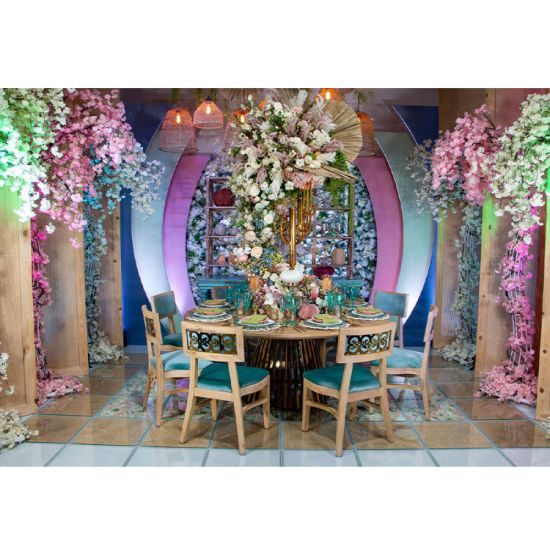 “72″ round Bohemian dining table with natural wood top and gold metal base, ideal for modern event dining and reception décor.