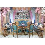 Vintage Jenny loveseat with dusty blue tufted upholstery and distressed wood legs, elegant seating for weddings, lounges, and events.