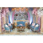 Vintage Jenny loveseat with dusty blue tufted upholstery and distressed wood legs, elegant seating for weddings, lounges, and events.