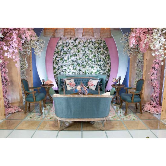 Vintage Paxton armchair with distressed wood frame and dusty blue upholstery, elegant seating for weddings, lounges, and events.