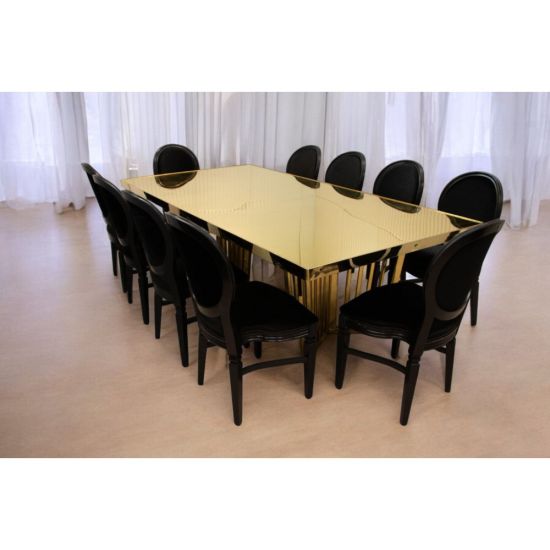 Varona Reflection dining table with gold frame and stainless steel gold top, mirror-finish rectangular surface and statement base for luxury events.