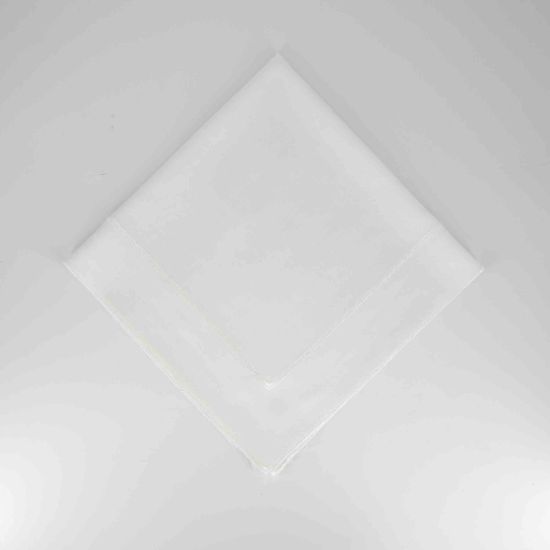 White Monarch napkin with clean solid fabric finish, neatly folded in a triangle on a white plate for classic weddings and formal event tables