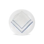White Monarch napkin with blue border trim detail, folded in a triangle on a white plate for coastal weddings and elegant event settings