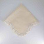 Ivory Scaloppini napkin with scalloped edge and stitched trim detail, folded on a white plate for classic weddings and elegant event décor