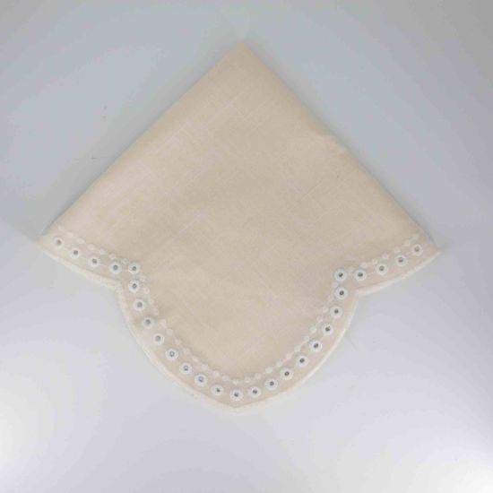 Ivory Scaloppini napkin with scalloped edge and stitched trim detail, folded on a white plate for classic weddings and elegant event décor