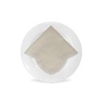 Ivory Scaloppini napkin with scalloped edge and stitched trim detail, folded on a white plate for classic weddings and elegant event décor