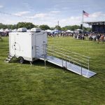 Floor plan diagram of luxury portable shower trailer showing multiple compartments and door locations for event shower rental planning