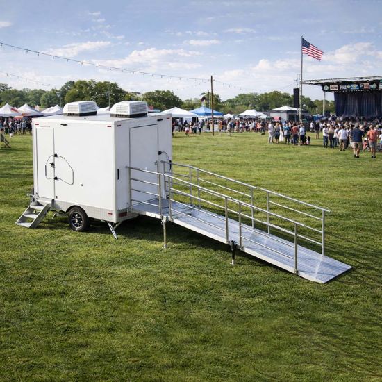 Floor plan diagram of luxury portable shower trailer showing multiple compartments and door locations for event shower rental planning