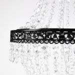 Black acrylic crystal chandelier set with tiered bead strands, elegant hanging décor lighting for weddings, lounges, and event staging.