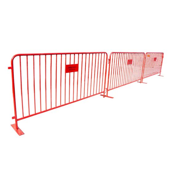 Red metal crowd control barrier with vertical bars and stabilizing feet, portable safety barricade for event lines, restricted areas, and venue security