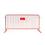 Red metal crowd control barrier with vertical bars and stabilizing feet, portable safety barricade for event lines, restricted areas, and venue security