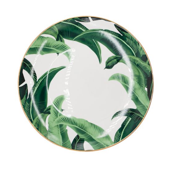 Banana leaf dinner plate with bold green foliage print framing the rim and gold edge, round design on a white background for tropical events