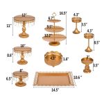 Assorted gold cake and dessert stands with pedestal risers and trays, luxury display set for weddings, parties, and dessert tables.