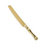 Gold cake knife server with serrated blade and decorative handle, designed for slicing and serving cakes at weddings and events