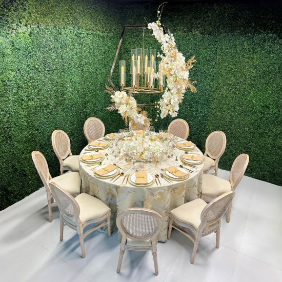 Gold hexagon chandelier stand with hanging crystal-style candle sleeves, modern geometric statement centerpiece for weddings and luxury events.