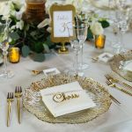 Gold deniz flower charger plate with radiating petal-like rim and smooth center, elegant statement charger for weddings and event tables