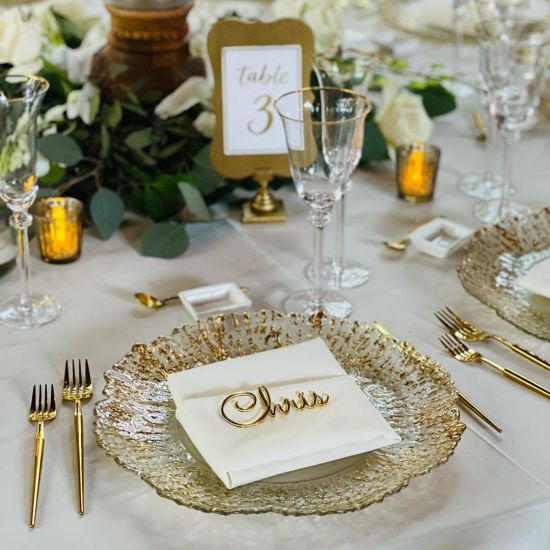 Gold deniz flower charger plate with radiating petal-like rim and smooth center, elegant statement charger for weddings and event tables