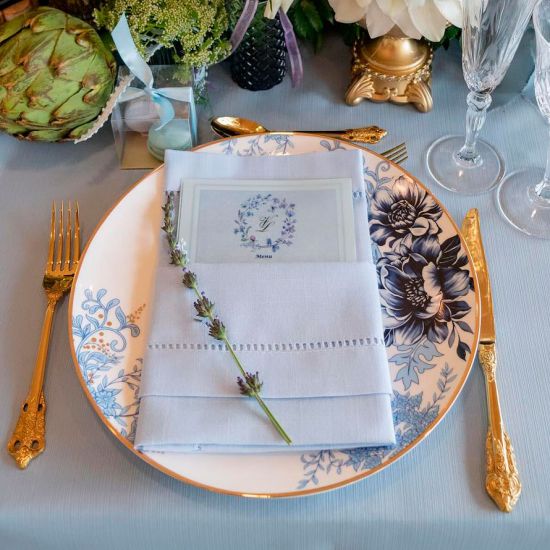 Lenox Garden Grove charger plate with white center, blue floral border accent, and thin gold rim, large round plate on a white background