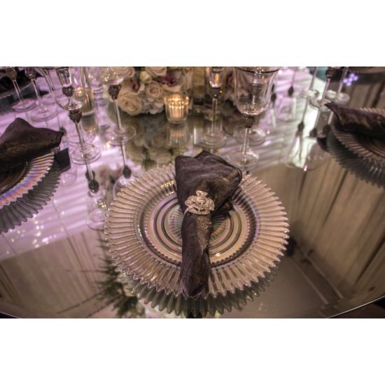 Gold rainbow charger plate with ribbed glass texture and metallic rim accents, warm-toned statement charger for weddings and gala tables