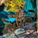 Gold stainless-steel Gem-frame end table with diamond-inspired geometry and glass top, ideal for luxury modern event lounge décor
