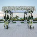 Tall gold mirrored neo-baroque column with ornate reflective panel design, luxury event decor pedestal for weddings and displays.