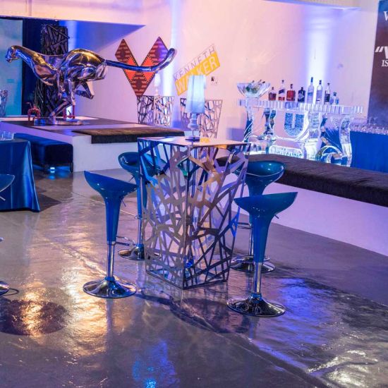 Black scoop-seat adjustable metal bar stool with chrome base and foot-rail, sleek contemporary event bar seating solution